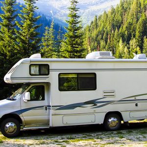 Recreational Vehicle Insurance - A recreational vehicle parked in the mountain woodland.