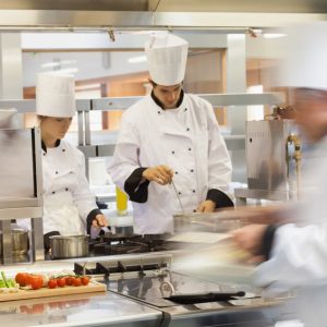 Restaurant Insurance - Professional cooks in an immaculate kitchen.